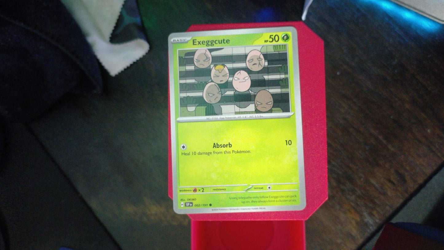 Exeggcute 002/191 Surging Sparks Pokemon C NM